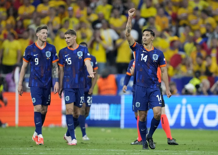 Soccer Football - Euro 2024 - Round of 16 - Romania v Netherlands - Munich Football Arena, Munich, Germany - July 2, 2024 Netherlands Tijjani Reijnders reacts after Donyell Malen scores their third goal REUTERS/Fiona Noever