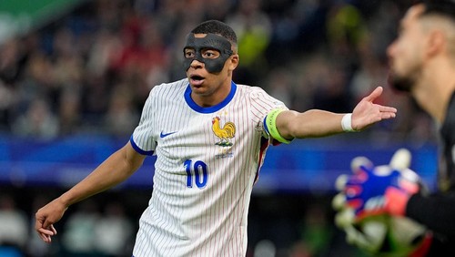 HAMBURG, GERMANY - JULY 05: Kylian Mbappe of France reacts after a position as he wears protective mask during the UEFA EURO 2024 Quarter-Final match between Portugal and France at Volksparkstadion on July 05, 2024 in Hamburg, Germany. (Photo by Emin Sansar/Anadolu via Getty Images)