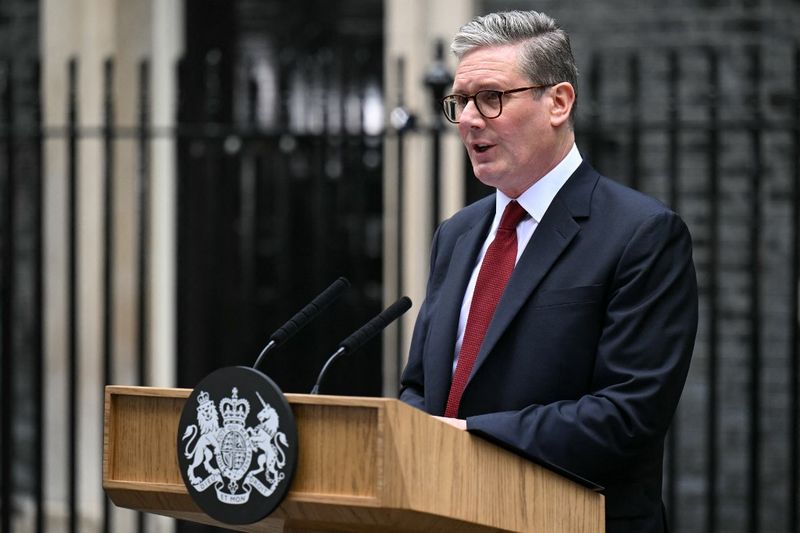 Britain's incoming Prime Minister Keir Starmer and leader of the Labour Party, stands at the podium as he addresses the nation following his general election victory, outside 10 Downing Street in London on July 5, 2024, a day after Britain held a general election. Starmer became Britain's new prime minister, as his centre-left opposition Labour party swept to a landslide general election victory, ending 14 years of right-wing Conservative rule. (Photo by Oli SCARFF / AFP)