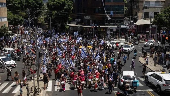 Protesters march along Dizengoff Street to demand the release of hostages held in Gaza, during a day of protests marking nine months since the deadly October 7 attack, in Tel Aviv, Israel, July 7, 2024. (Reuters)
