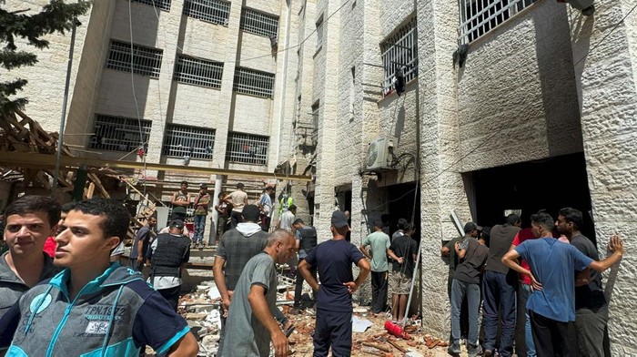 Mourners gather around the bodies of Palestinians, including Ehab Al-Ghussein, the Hamas-appointed deputy minister of labour, who were killed in an Israeli strike, amid Israel-Hamas conflict, at a hospital in Gaza City, July 7, 2024. REUTERS/Dawoud Abu Alkas