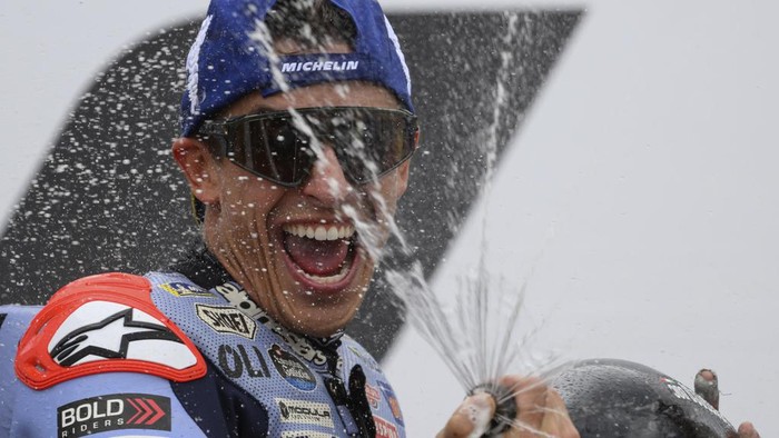 Spains Marc Marquez celebrates his second place after completing the German MotoGP event in Hohenstein-Ernstthal, Germany, Sunday, July 7, 2024. (Robert Michael/dpa via AP)