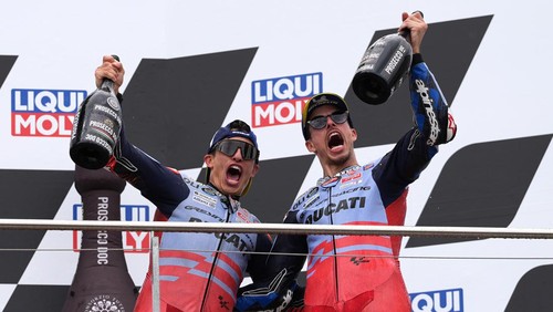 HOHENSTEIN-ERNSTTHAL, GERMANY - JULY 07: Marc Marquez of Spain and Gresini Racing MotoGP and Alex Marquez of Spain and Gresini Racing MotoGP celebrate on the podium after the MotoGP of Germany at the Sachsenring Circuit on July 07, 2024 in Hohenstein-Ernstthal, Germany. (Photo by Mark Wieland/Getty Images)
