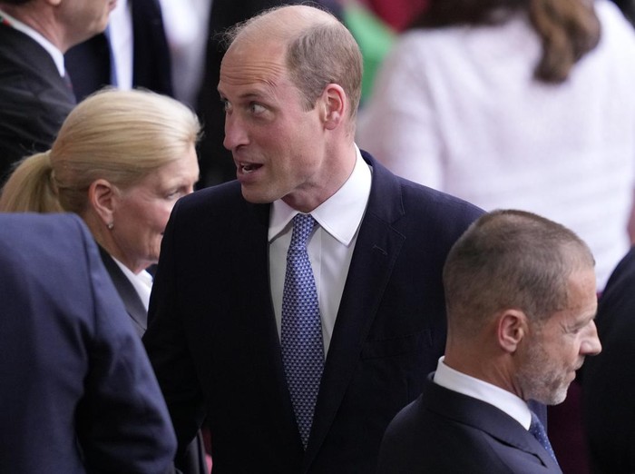 Britains Prince William stands next to UEFA president Aleksander Ceferin before a quarterfinal match between England and Switzerland at the Euro 2024 soccer tournament in Duesseldorf, Germany, Saturday, July 6, 2024. (AP Photo/Andreea Alexandru)