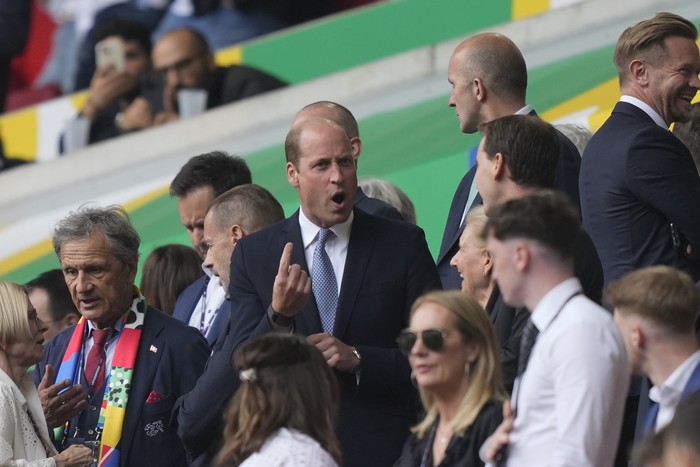 Britains Prince William, center, speaks with attendees prior to a quarterfinal match between England and Switzerland at the Euro 2024 soccer tournament in Duesseldorf, Germany, Saturday, July 6, 2024. (AP Photo/Martin Meissner)