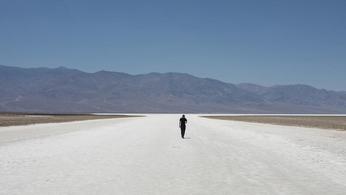 Tourists take photos in front of the Furnace Creek visitor center thermometer Monday, July 8, 2024, in Death Valley National Park, Calif.  (Daniel Jacobi II/Las Vegas Review-Journal via AP)