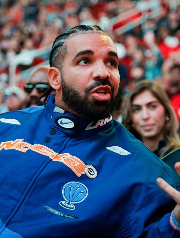 Drake HOUSTON, TEXAS - MARCH 16: Rapper, songwriter, and icon Drake attends a game between the Houston Rockets and the Cleveland Cavaliers at Toyota Center on March 16, 2024 in Houston, Texas. NOTE TO USER: User expressly acknowledges and agrees that, by downloading and or using this photograph, User is consenting to the terms and conditions of the Getty Images License Agreement. (Photo by Carmen Mandato/Getty Images)
