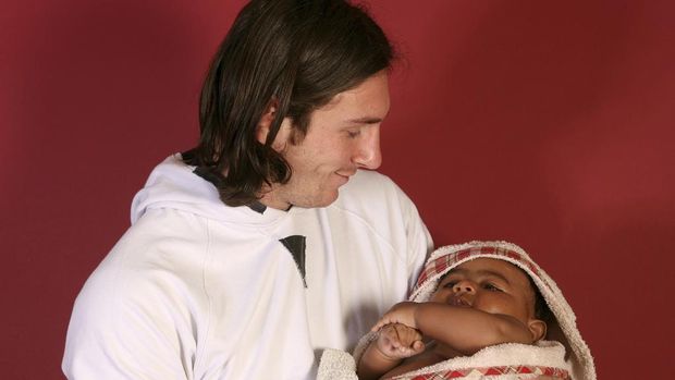 This photo taken in Sept. 2007 shows a 20-year-old Lionel Messi, who had embarked on his legendary Barcelona career just over four years prior, cradling Lamine Yamal, who was merely six months old at the time during a photo session in the dressing room of the Camp Nou stadium in Barcelona, Spain. Lamine Yamal is now a soccer sensation for both Spain and Barcelona and he is still only 16-years-old. (AP Photo/Joan Monfort)