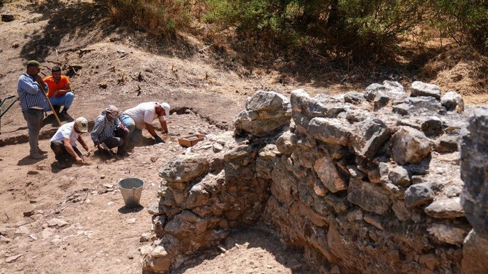 IZMIR, TURKIYE - JULY 03: An aerial view of Ephesus, designated as a UNESCO World Heritage Site in 2015, shows visitors as excavation continues to unearth the Koressos Gate, one of the three major gates of the ancient city of Ephesus, in Izmir, Turkiye on July 03, 2024. Excavation and restoration works have been ongoing for 161 years in Ephesus, one of the largest tourism, trade and port cities of the ancient period. (Photo by Mehmet Emin Menguarslan/Anadolu via Getty Images)