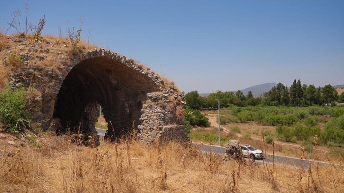 IZMIR, TURKIYE - JULY 03: An aerial view of Ephesus, designated as a UNESCO World Heritage Site in 2015, shows visitors as excavation continues to unearth the Koressos Gate, one of the three major gates of the ancient city of Ephesus, in Izmir, Turkiye on July 03, 2024. Excavation and restoration works have been ongoing for 161 years in Ephesus, one of the largest tourism, trade and port cities of the ancient period. (Photo by Mehmet Emin Menguarslan/Anadolu via Getty Images)