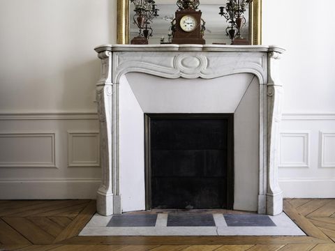 Fireplace in Parisian apartment/home.