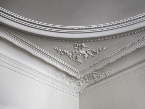 Close up shot of the corner of a ceiling in a luxurious Paris apartment.