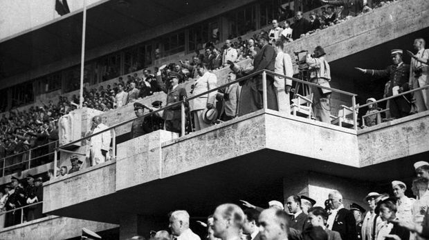 FILE - In this Aug. 2, 1936 file photo Adolf Hitler and Colonel General Hermann Goering are on the grand stand in the stadium watching the events on the field at the Olympics in Berlin. Scars of World War II and relics from its Nazi past are preserved at Berlin's Olympiastadion. When Spain plays England in the European Championship final, they will be playing in a stadium that doesn't hide it was built by the Nazis for the 1936 Olympic Games. (AP Photo, file)