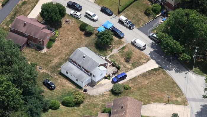 An aerial view shows vehicles of law enforcement members who work at the home of 20-year-old Thomas Matthew Crooks, named by the FBI as the 
