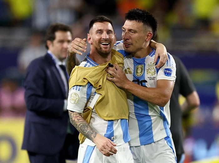 Soccer Football - Copa America 2024 - Final - Argentina v Colombia - Hard Rock Stadium, Miami, Florida, United States - July 15, 2024
Argentinas Lionel Messi and Lisandro Martinez celebrate after winning the final REUTERS/Agustin Marcarian