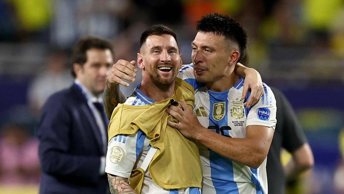 Soccer Football - Copa America 2024 - Final - Argentina v Colombia - Hard Rock Stadium, Miami, Florida, United States - July 15, 2024
Argentinas Lionel Messi and Lisandro Martinez celebrate after winning the final REUTERS/Agustin Marcarian