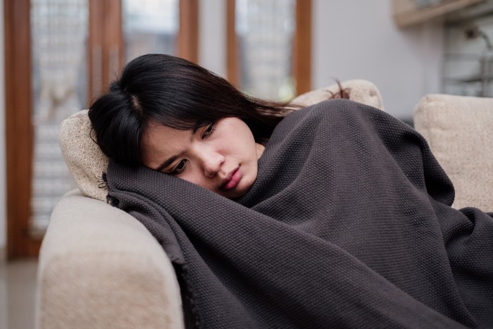 Portrait of a sleeping sick flu young woman asian at home. Pandemic 2019 Coronavirus 2019-nCoV Concept.