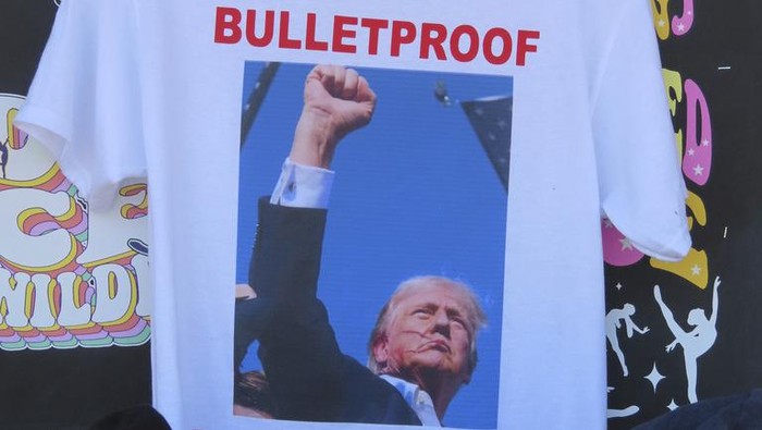 T-shirts referencing the shooting of former President Donald Trump were selling briskly on the boardwalk in Wildwood, N.J. on July 15, 2024, less than 48 hours after the incident. (AP Photo/Wayne Parry)