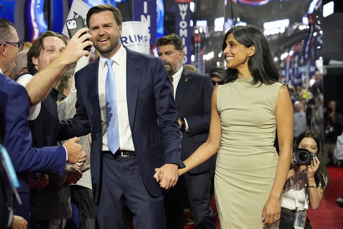 Republican vice presidential candidate Sen. JD Vance arrives with his wife Usha Chilukuri Vance at the Republican National Convention Monday, July 15, 2024, in Milwaukee. (AP/Carolyn Kaster/AP Photo/Paul Sancya)