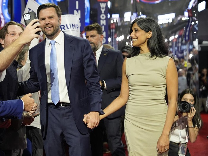 Republican vice presidential candidate Sen. JD Vance arrives with his wife Usha Chilukuri Vance at the Republican National Convention Monday, July 15, 2024, in Milwaukee. (AP/Carolyn Kaster/AP Photo/Paul Sancya)