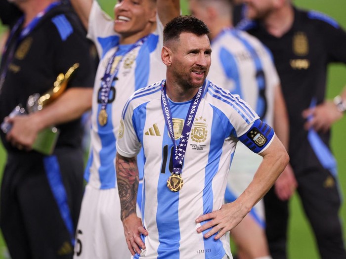 Jul 14, 2024; Miami, FL, USA;  Argentina forward Lionel Messi (10) celebrates after winning the Copa America Final against Colombia at Hard Rock Stadium. Mandatory Credit: Nathan Ray Seebeck-USA TODAY Sports