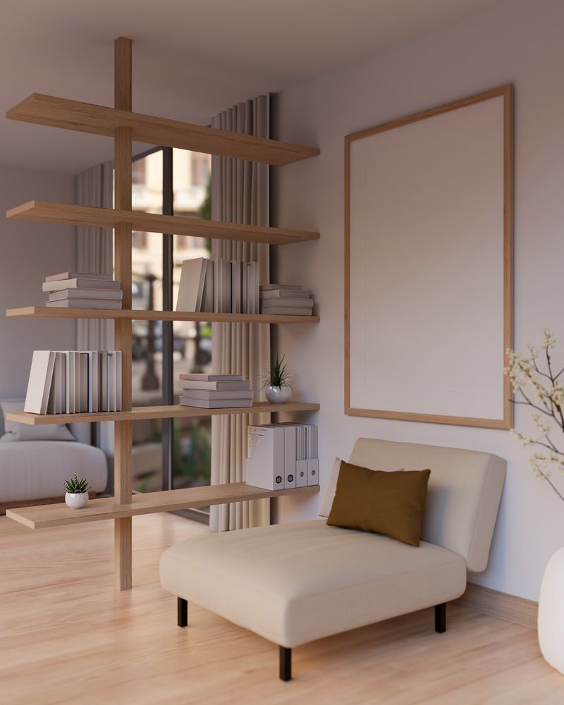 Side view image of a modern, cosy living room with a cosy chair, a frame mockup on the white wall, a bookshelf, and a parquet floor. 3d render, 3d illustration