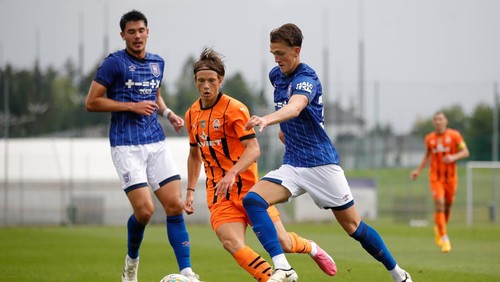 VILLACH, AUSTRIA - JULY 20: Finley Barbrook of Ipswich Town in action as Luka Latsabidze of Shakhtar Donetsk covers his run during the friendly match between Ipswich Town and Shakhtar Donetsk at Sportzentrum Landskron on July 20, 2024 in Villach, Austria. (Photo by Timothy Rogers/Getty Images)