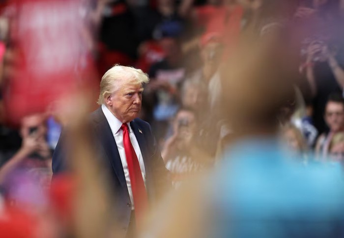 Donald Trump Republican presidential nominee and former U.S. President Donald Trump looks on, as he holds a campaign rally for the first time with his running mate, Republican vice presidential nominee U.S. Senator J.D. Vance (R-OH) in Grand Rapids, Michigan, U.S. July 20, 2024. REUTERS/Tom Brenner/File Photo Purchase Licensing Rights