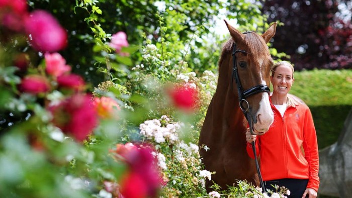 NEWENT, ENGLAND - JULY 02:  Charlotte Dujardin poses with her horse Pete (Imhotep) during a Team GB Paris 2024 Olympic Games equestrian team announcement at Oakelbrook Mill on July 02, 2024 in Newent, England. (Photo by Dan Istitene/Getty Images)