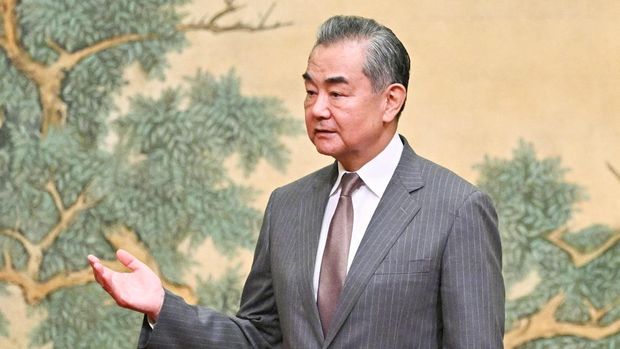 China's Foreign Minister Wang Yi gestures during an event hosting Mahmoud al-Aloul (not pictured), Vice Chairman of the Central Committee of Palestinian organisation and political party Fatah, and Mussa Abu Marzuk (not pictured), senior member of the Palestinian Islamist movement Hamas, at the Diaoyutai State Guesthouse in Beijing on July 23, 2024. PEDRO PARDO/Pool via REUTERS