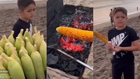 Saat menikmati waktu luang di pantai, El juga membeli jagung bakar. Ia ditemani oleh Jessica saat itu. Foto: Instagram/YouTube