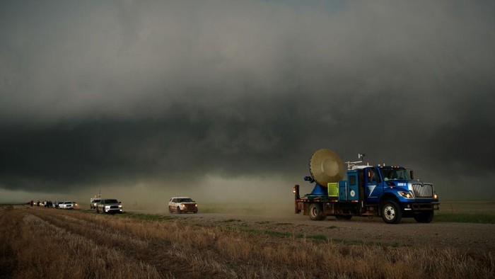 ELBERT COUNTY, CO - MAY 8: The Doppler on Wheels (DOW) vehicle scans a supercell thunderstorm during a tornado research mission, May 8, 2017 in Elbert County near Agate, Colorado. Doppler on Wheels (DOW) is a mobile doppler radar mounted on a truck that brings instruments directly into storms, allowing scientists to scan storms and tornadoes and make 3-D maps of wind and debris. With funding from the National Science Foundation and other government grants, scientists and meteorologists from the Center for Severe Weather Research try to get close to supercell storms and tornadoes trying to better understand tornado structure and strength, how low-level winds affect and damage buildings, and to learn more about tornado formation and prediction. (Photo by Drew Angerer/Getty Images)