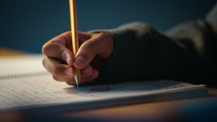 Student hold book after finish study  at university.