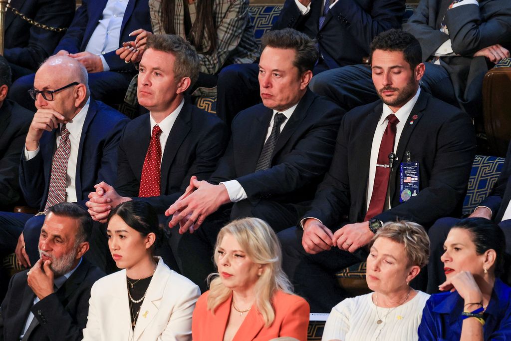 Elon Musk, CEO of SpaceX and Tesla, listens to Israeli Prime Minister Benjamin Netanyahu as he addresses a joint meeting of Congress, at the U.S. Capitol in Washington, U.S., July 24, 2024. REUTERS/Kevin Mohatt