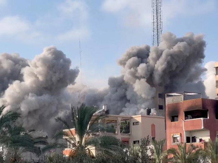 Smoke rises following an Israeli strike on a residential building, amid the ongoing conflict between Israel and Hamas, in Nuseirat in the central Gaza Strip, in this still picture taken from a video, July 24, 2024. Reuters TV via REUTERS Purchase Licensing Rights