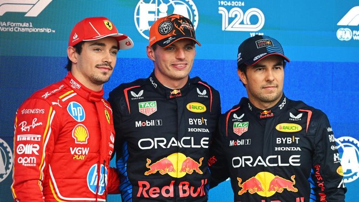SPA, BELGIUM - JULY 27: Pole position qualifier Max Verstappen of the Netherlands and Oracle Red Bull Racing, Second placed qualifier Charles Leclerc of Monaco and Ferrari and Third placed qualifier Sergio Perez of Mexico and Oracle Red Bull Racing talk in parc ferme during qualifying ahead of the F1 Grand Prix of Belgium at Circuit de Spa-Francorchamps on July 27, 2024 in Spa, Belgium. (Photo by Rudy Carezzevoli/Getty Images)