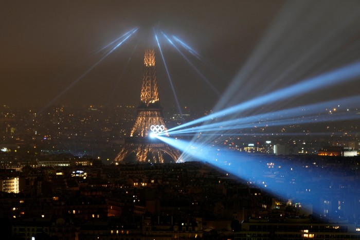 Paris 2024 Olympics - Opening Ceremony - Paris, France - July 26, 2024. A laser show is projected from the Eiffel Tower in Paris, France, during the opening ceremony of the 2024 Summer Olympics, Friday, July 26, 2024.     Brian Inganga/Pool via REUTERS