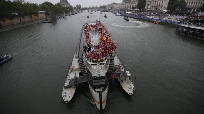 Spain team parades along the Seine river in Paris, France, during the opening ceremony of the 2024 Summer Olympics, Friday, July 26, 2024. (AP Photo/Christophe Ena)