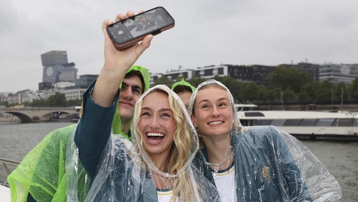 Athletes of Team Australia take a selfie on a boat on the Seine during the opening ceremony of the 2024 Summer Olympics in Paris, France, Friday,  July 26, 2024.(Quinn Rooney/Pool Photo via AP)