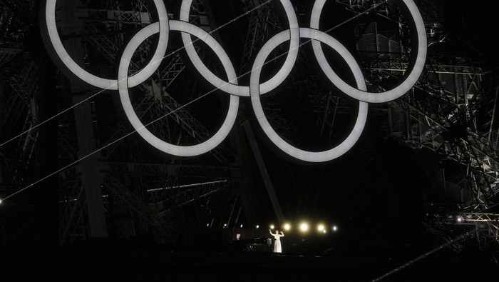 Singer Celine Dion performs from the Eiffel Tower in Paris, France, during the opening ceremony of the 2024 Summer Olympics, Friday, July 26, 2024. (AP Photo/Abbie Parr)