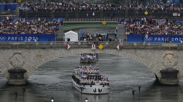 Team Greece travels by boat along the Seine river in Paris, France, during the opening ceremony of the 2024 Summer Olympics, Friday, July 26, 2024. (AP Photo/Ricardo Mazalan)