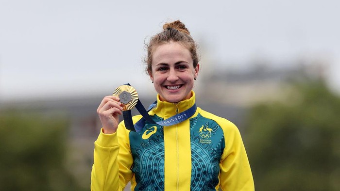 PARIS, FRANCE - JULY 27: Gold medalist Grace Brown of Team Australia poses on the podium during the Womens Individual Time Trial on day one of the Olympic Games Paris 2024 at Pont Alexandre III on July 27, 2024 in Paris, France. (Photo by Tim de Waele/Getty Images)
