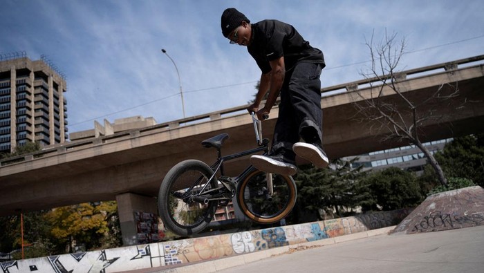 A rider performs a trick during a celebration of World BMX Day, in Johannesburg, South Africa, July 20, 2024. REUTERS/Ihsaan Haffejee       TPX IMAGES OF THE DAY