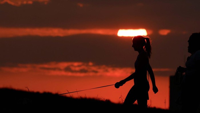 A person walks near Madliena Tower at sunset in Pembroke, Malta, July 30, 2024. REUTERS/Darrin Zammit Lupi