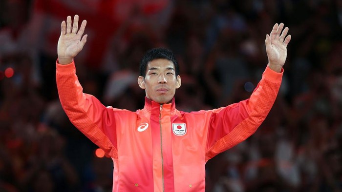 PARIS, FRANCE - JULY 30: Gold medalist Takanori Nagase of Team Japan celebrates on the podium during the Womens Judo Men -81 kg medal ceremony  on day four of the Olympic Games Paris 2024 at Champs-de-Mars Arena on July 30, 2024 in Paris, France. (Photo by Steph Chambers/Getty Images)