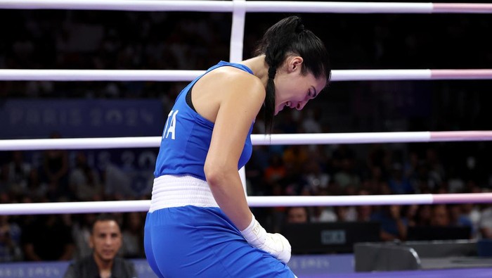 PARIS, FRANCE - AUGUST 01: Angela Carini of Team Italy reacts after abandoning her Womens 66kg preliminary round match against Imane Khelif of Team Algeria in the first round on day six of the Olympic Games Paris 2024 at North Paris Arena on August 01, 2024 in Paris, France. (Photo by Richard Pelham/Getty Images)