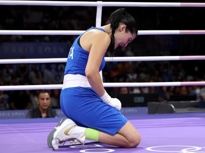PARIS, FRANCE - AUGUST 01: Angela Carini of Team Italy reacts after abandoning her Womens 66kg preliminary round match against Imane Khelif of Team Algeria in the first round on day six of the Olympic Games Paris 2024 at North Paris Arena on August 01, 2024 in Paris, France. (Photo by Richard Pelham/Getty Images)