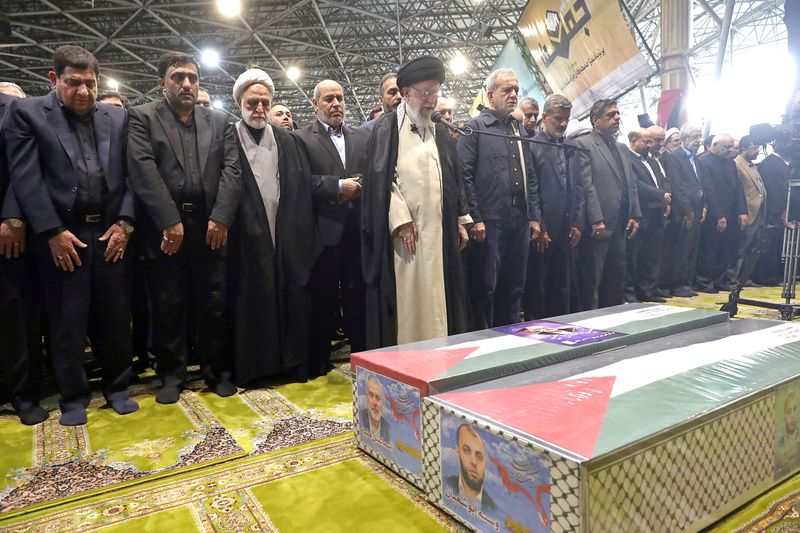 Iran's Supreme Leader Ayatollah Ali Khamenei performs prayer at the funeral of assassinated Hamas chief, Ismail Haniyeh, in Tehran, Iran, August 1, 2024. Office of the Iranian Supreme Leader/WANA (West Asia News Agency) Handout via REUTERS ATTENTION EDITORS - THIS PICTURE WAS PROVIDED BY A THIRD PARTY