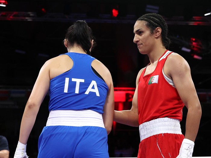 PARIS, FRANCE - AUGUST 01: Imane Khelif of Team Algeria interacts with Angela Carini of Team Italy after she abandons the Womens 66kg preliminary round match in the first round on day six of the Olympic Games Paris 2024 at North Paris Arena on August 01, 2024 in Paris, France. (Photo by Richard Pelham/Getty Images)