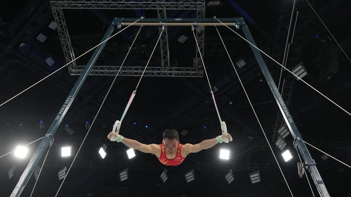Xiao Ruoteng, of China, performs on the rings during the men's artistic gymnastics all-around finals in Bercy Arena at the 2024 Summer Olympics, Wednesday, July 31, 2024, in Paris, France. (AP Photo/Abbie Parr)